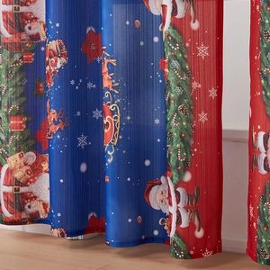 Detailed fabric texture of Christmas curtains with festive Santa and reindeer print