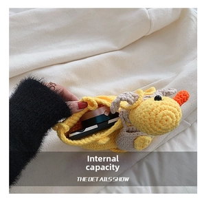Detail showing the internal capacity of the knitted duck bag with daily cosmetics