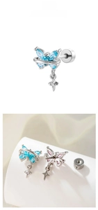 Detailed view of butterfly stud earrings with marquise crystal and cross pendants