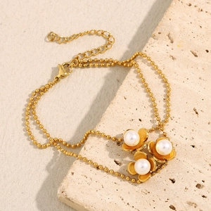 Detail of 18K gold-plated double-layer bead bracelet featuring pearl flower charms