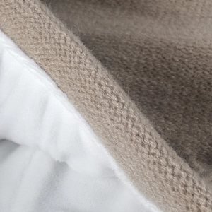 Winter knit slouchy beanie with warm white fleece lining and brown textured exterior
