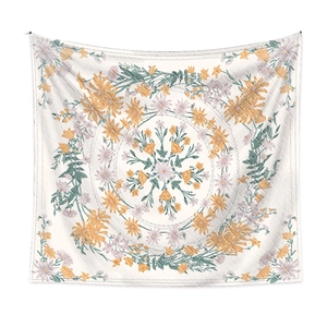 Detailed pattern of a square floral mandala tapestry in vibrant orange and purple tones