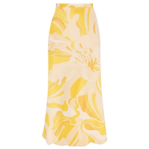 Detail of high-waisted midi skirt featuring abstract floral prints and scalloped hemline