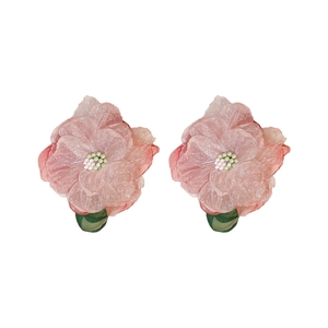 Pink fabric flower earrings with glitter petals and green leaf accents for women