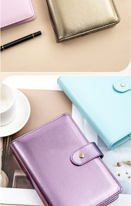 Flat lay of macaron color A6 PU leather notebooks in pink, gold, purple and sky blue