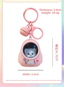 Pink space capsule cat keychain dimensions showing height 4.7cm and width 4.3cm