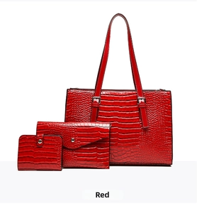 Three-piece red crocodile pattern tote bag set with matching clutch and small wallet