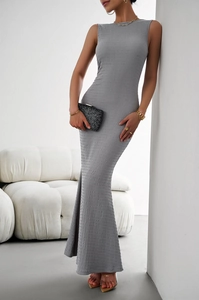 Detail showing the textured knit fabric and backless design of this grey bodycon dress