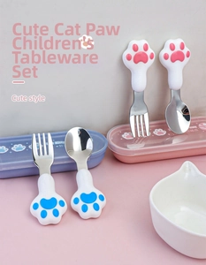 Detail of 304 stainless steel cat paw fork and spoon set in pink and blue storage boxes