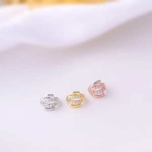 Detailed trio of gold, silver, and rose gold ear cuffs with micro-set cubic zirconia stones