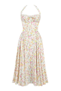 Detail of floral halter dress featuring ruched chest design and a vintage print