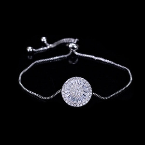 Detail of silver plated 18K gold bracelet with micro-pave zircon disc and adjustable bolo clasp