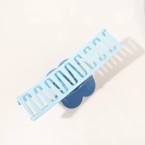 Sweet blue heart shark hair claw clip for thick hair, 45-degree angle view on white back