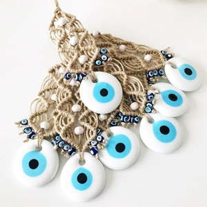 Bohemian Evil Eye wall hanging with beige woven rope and white wooden beads