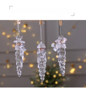 Three transparent acrylic icicle snowman ornaments hanging with clips for Christmas tree