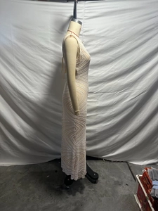 Detail view of champagne sleeveless sequined maxi dress with geometric wave patterns