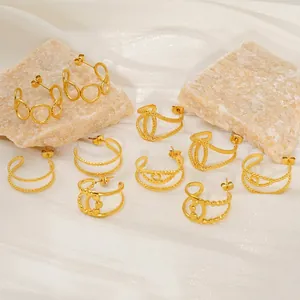 Chic gold double-layered geometric hollow earrings set on premium textured fabric