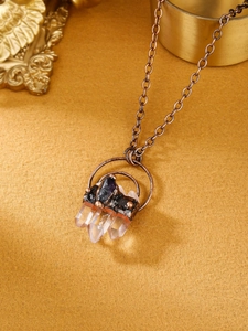 Vintage necklace with natural white crystal points and raw amethyst in bronze rings