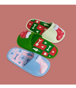 Detailed view of colorful Christmas slipper pet snuffle toys with festive patterns