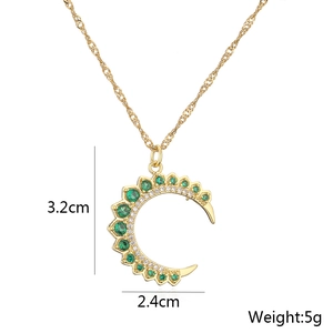 Detail showing 3.2cm x 2.4cm gold crescent pendant with green stones and weight specs