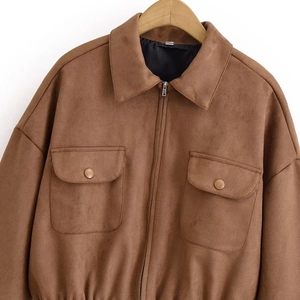 Detailed view of brown faux suede jacket with zipper closure and two front pockets