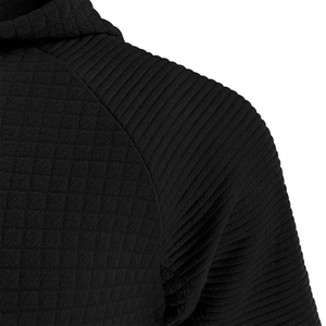 Detail of waffle knit fabric and ribbed panels on black hoodie shoulder area