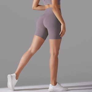 Detail view of high-waist lavender yoga shorts featuring seamless butt-lifting design