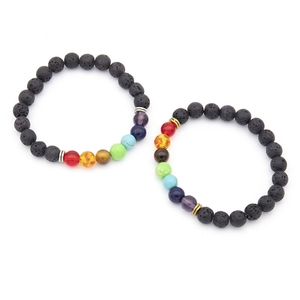 Handmade chakra bracelet with natural volcanic lava stones and tiger eye beads on white
