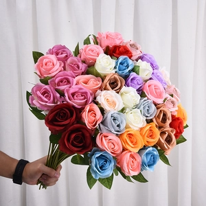 Handheld bouquet of colorful artificial silk roses for wedding and home decoration