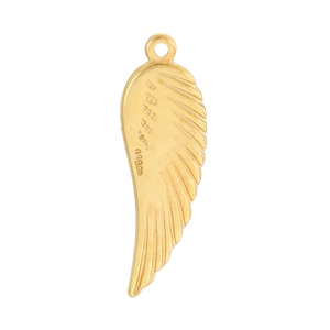 Macro shot of detailed golden feather wing pendant with sharp texture on white background