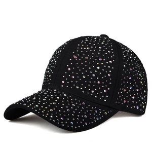 Close-up of a black baseball cap with colorful rhinestones on a white background
