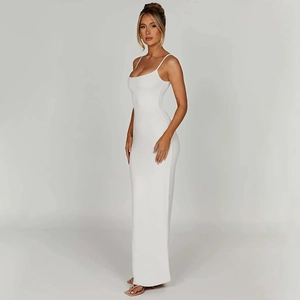 Detail showing backless design and slim fit cut of a white long bodycon camisole dress