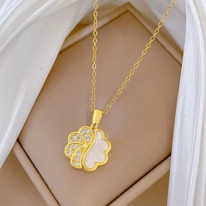 Luxurious gold stainless steel shell pendant necklace with diamonds on silk