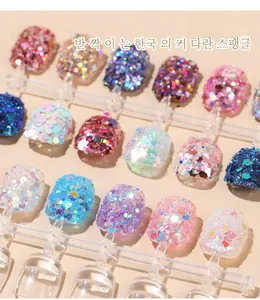 Close-up of mixed laser hexagon nail sequins on transparent display tips