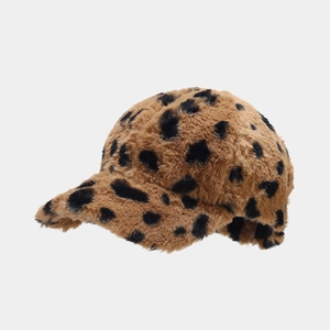 Close-up of leopard print faux fur texture on a warm winter baseball cap