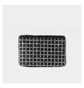 Detail of black rhinestone clutch bag showing silver crystal grid and top metal zipper