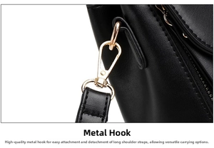Detail of gold metal hook and grain leather texture on detachable shoulder strap bag