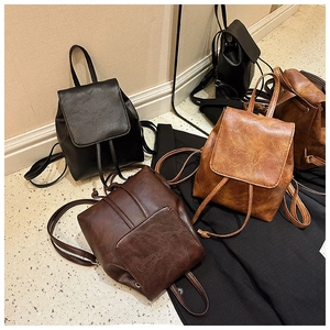 Multi-color vintage mini backpacks with drawstring closure and slim straps in faux leather