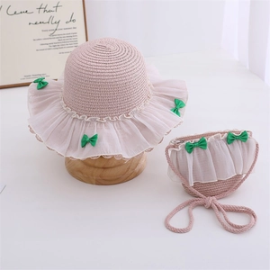 Pink straw hat and matching purse set with white lace trim and green bows for girls