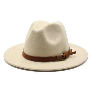 Detail of cream wool fedora hat featuring a brown leather band and metal buckle