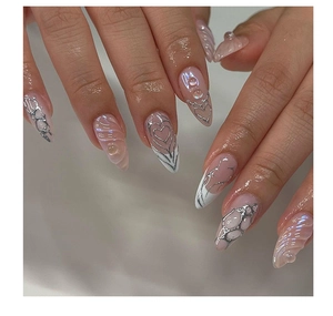 Close-up of pink 3D water ripple press-on nails with silver metallic heart and geometric art