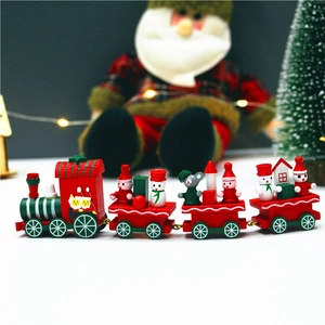 Detail view of a festive wooden Christmas train with miniature Santa and snowman figures