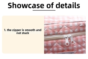 Detail of pink plaid quilted organizer featuring a smooth dual-zipper closure system