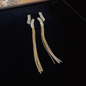Elegant gold-tone tassel earrings featuring sparkling rhinestones and long chain fringe