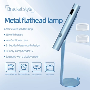 Detail view of the blue handheld UV nail lamp showing silicone head and charging display