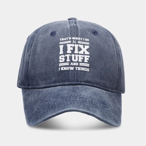 Detail of washed navy cotton baseball cap with vintage finish and funny printed slogan