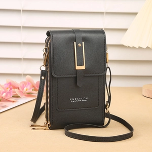 Close-up of black leather crossbody phone bag with three zippers and gold hardware detail