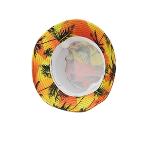 Detail view of tropical palm tree print bucket hat featuring sunset gradient and inner lining