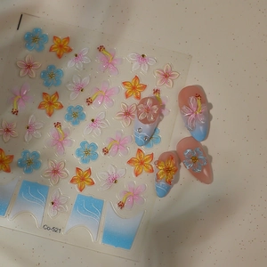 Detailed view of 3D embossed floral nail art stickers with Co-521 blue and pink flower designs
