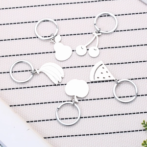 Minimalist stainless steel fruit keychains featuring pear cherry apple and banana shapes